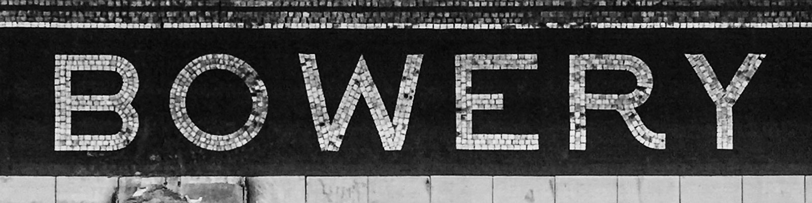 Mosaic name tablet at Bowery