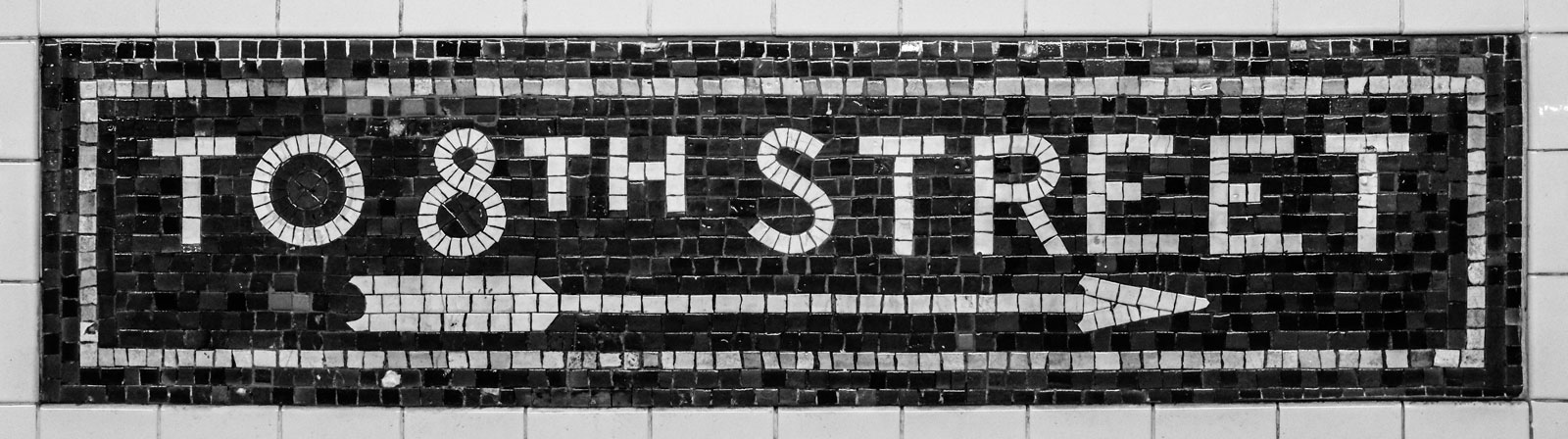 Mosaic sign at 8th Street